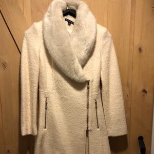 Beautiful Cream coat with fur collar.